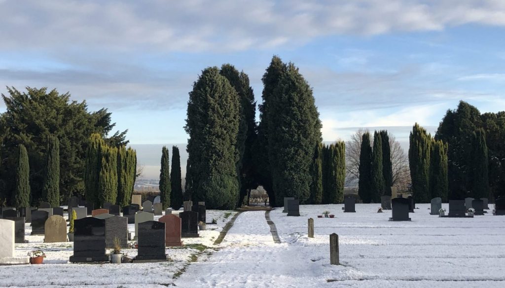 An image of Woodborough cemetery covered in snow